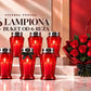 Set of six red glass memorial lanterns with lit candles and roses